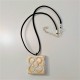 Collar Flor de Barcelona, Panot grande acabado metal dorado