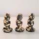 3 figuretes de Caganer en resina ceràmica gris amb acabat metall daurat