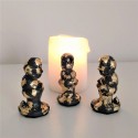 3 figuretes de Caganer en resina ceràmica gris amb acabat metall daurat