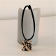 Collar Flor de Barcelona, Panot pequeño acabado metal dorado
