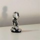 3 figuretes de Caganer en resina ceràmica gris amb acabat metall platejat