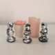 3 figuretes de Caganer en resina ceràmica gris amb acabat metall platejat