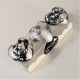 3 petjapapers de cor gris amb acabat de metall platejatat