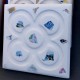 4 coasters with inlaid ceramic pieces
